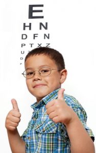Little Boy Happy with Glasses at Optometrist's Office